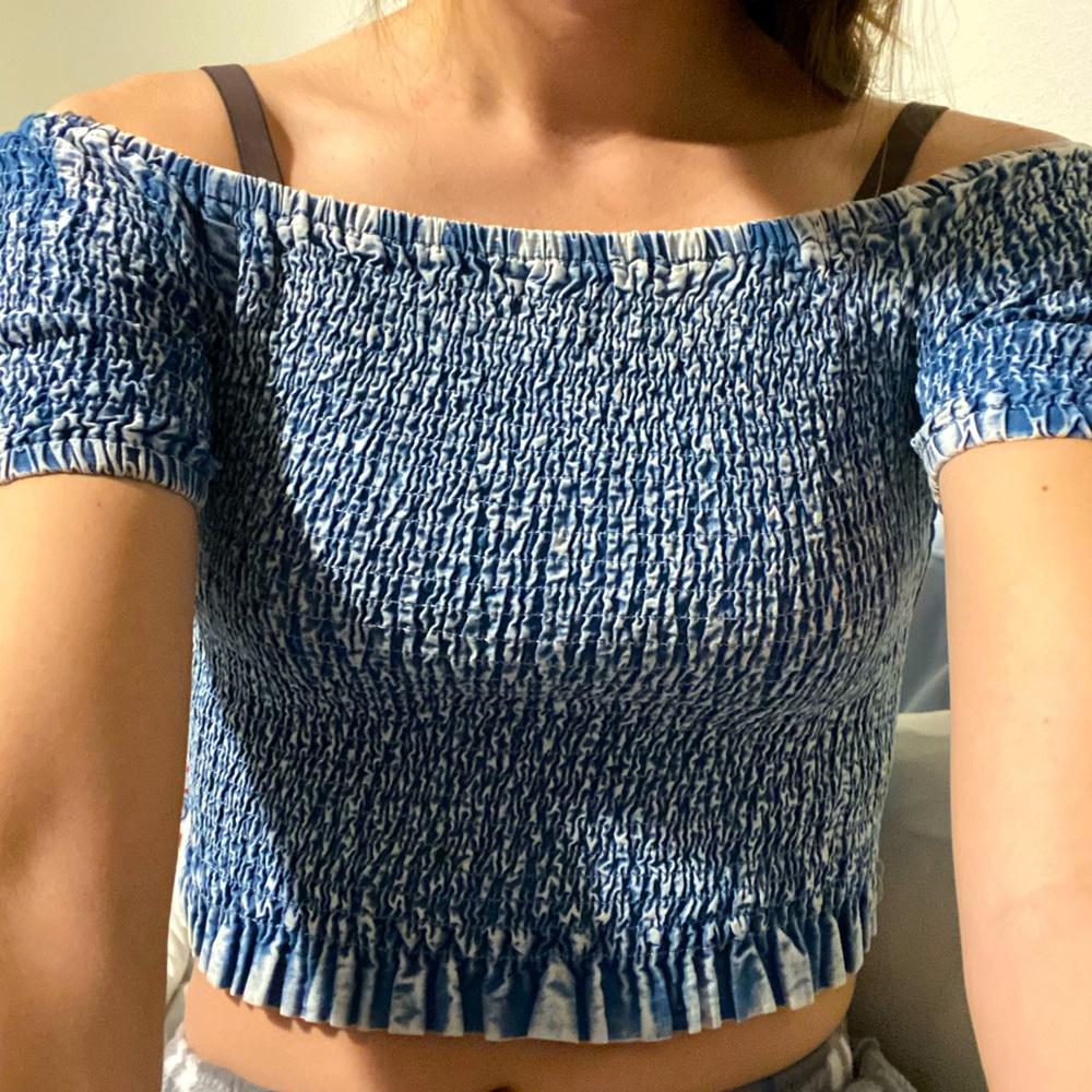 Loveres blue and white off the shoulder crop top.